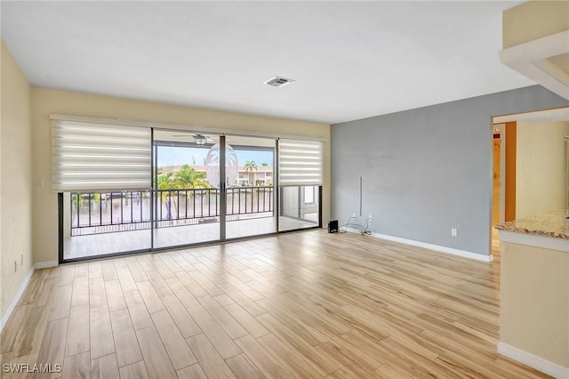 4210 SE 20th Pl Unit C2, Cape Coral, FL 33904 - empty room featuring healthy amount of natural light and light wood-style floors