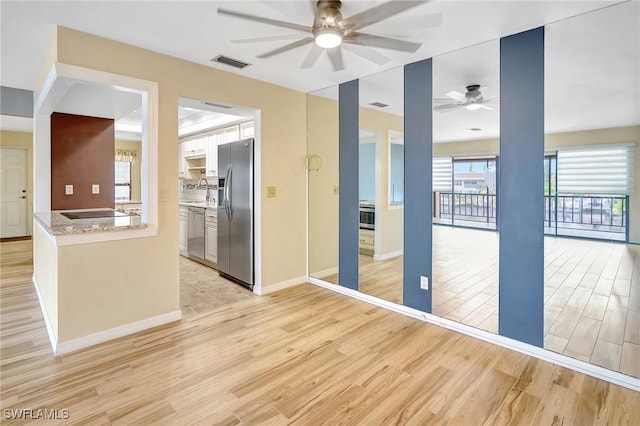 4210 SE 20th Pl Unit C2, Cape Coral, FL 33904 - empty room with ceiling fan and light wood-style flooring
