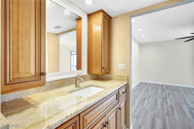 4210 SE 20th Pl Unit C2, Cape Coral, FL 33904 - bathroom with vanity, wood finished floors, recessed lighting, and a ceiling fan