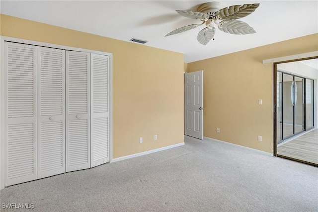 4210 SE 20th Pl Unit C2, Cape Coral, FL 33904 - unfurnished bedroom featuring carpet flooring, a closet, and a ceiling fan