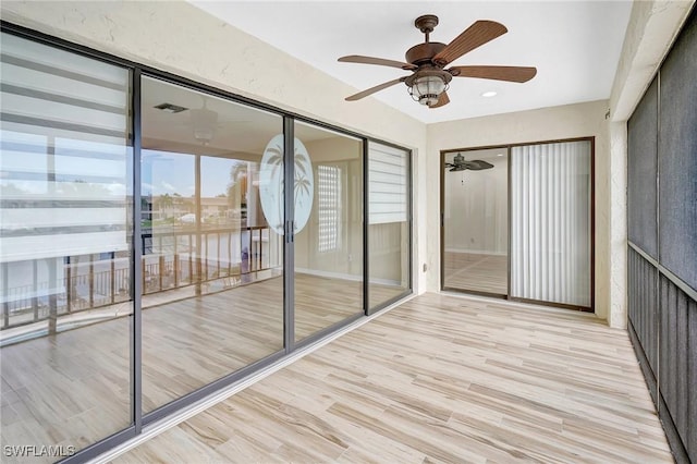 4210 SE 20th Pl Unit C2, Cape Coral, FL 33904 - unfurnished sunroom featuring ceiling fan, wood finished floors, and recessed lighting