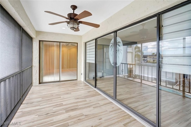 4210 SE 20th Pl Unit C2, Cape Coral, FL 33904 - unfurnished sunroom featuring ceiling fan and wood finished floors