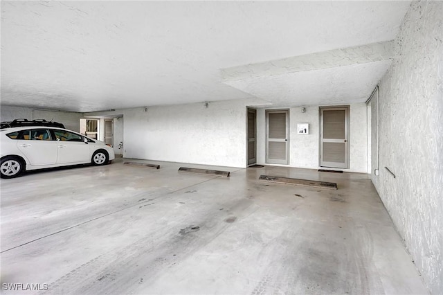 4210 SE 20th Pl Unit C2, Cape Coral, FL 33904 - garage featuring a textured wall