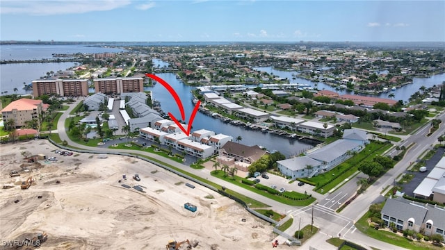 4210 SE 20th Pl Unit C2, Cape Coral, FL 33904 - aerial perspective of suburban area featuring a large body of water