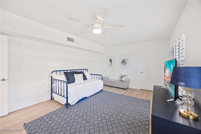 3070 Gulf Shore Blvd N Unit 104, Naples, FL 34103 - bedroom featuring light wood-style flooring and a ceiling fan