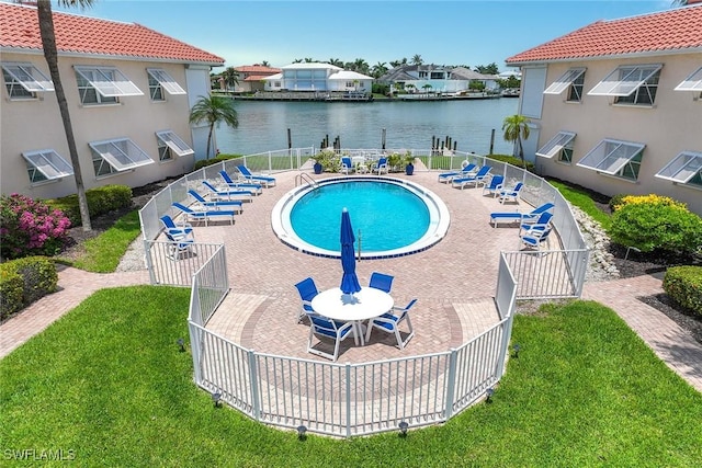 3070 Gulf Shore Blvd N Unit 104, Naples, FL 34103 - community pool featuring a water view and a patio
