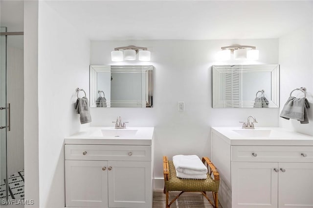 3070 Gulf Shore Blvd N Unit 104, Naples, FL 34103 - bathroom with two vanities and a stall shower