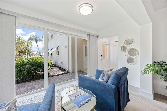 3070 Gulf Shore Blvd N Unit 104, Naples, FL 34103 - living room featuring baseboards and light wood finished floors