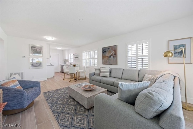 3070 Gulf Shore Blvd N Unit 104, Naples, FL 34103 - living area featuring light wood finished floors and baseboards