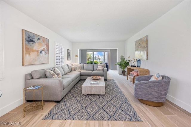 3070 Gulf Shore Blvd N Unit 104, Naples, FL 34103 - living area featuring light wood finished floors and baseboards