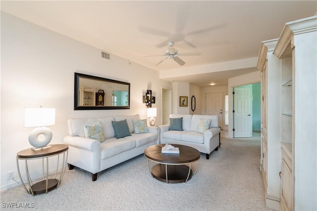 13221 Sherburne Cir Unit 601, Bonita Springs, FL 34135 - carpeted living room featuring a ceiling fan and baseboards
