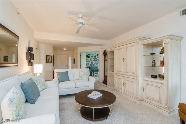 13221 Sherburne Cir Unit 601, Bonita Springs, FL 34135 - living area with ceiling fan and light colored carpet