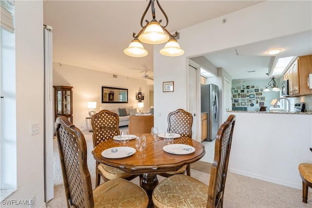 13221 Sherburne Cir Unit 601, Bonita Springs, FL 34135 - dining space with ceiling fan and light colored carpet