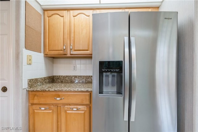 13221 Sherburne Cir Unit 601, Bonita Springs, FL 34135 - kitchen with stainless steel fridge with ice dispenser, decorative backsplash, and dark stone countertops