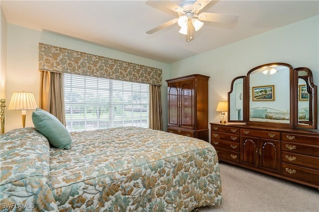 13221 Sherburne Cir Unit 601, Bonita Springs, FL 34135 - bedroom with light carpet and a ceiling fan
