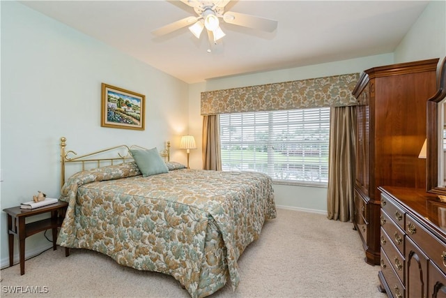 13221 Sherburne Cir Unit 601, Bonita Springs, FL 34135 - bedroom with light carpet and a ceiling fan