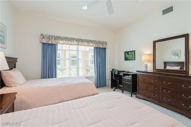 13221 Sherburne Cir Unit 601, Bonita Springs, FL 34135 - carpeted bedroom featuring a ceiling fan and a desk