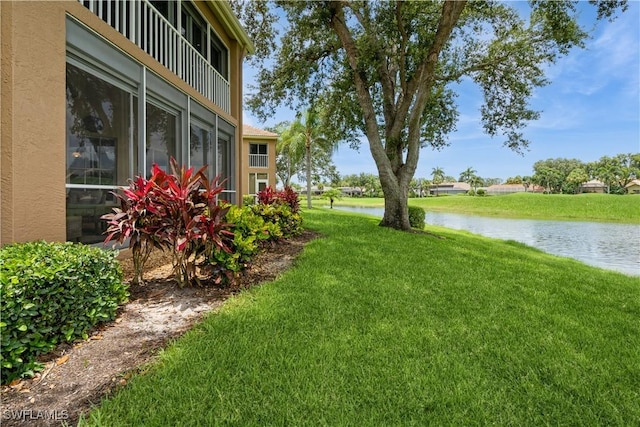 13221 Sherburne Cir Unit 601, Bonita Springs, FL 34135 - view of green lawn featuring a water view