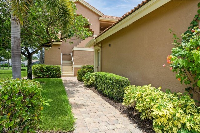 13221 Sherburne Cir Unit 601, Bonita Springs, FL 34135 - entrance to property with stucco siding and a tile roof