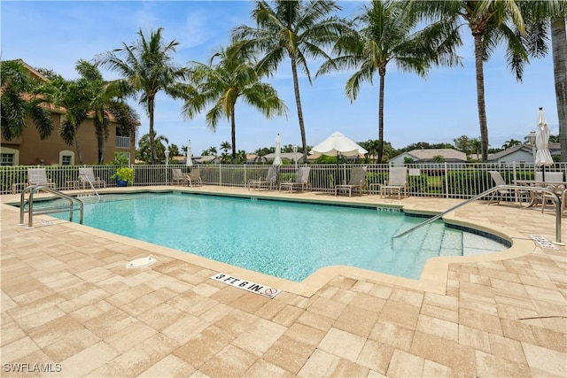 13221 Sherburne Cir Unit 601, Bonita Springs, FL 34135 - community pool with a patio
