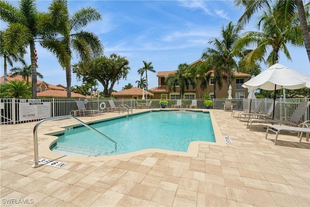 13221 Sherburne Cir Unit 601, Bonita Springs, FL 34135 - community pool featuring a patio area