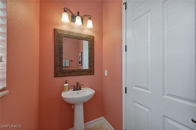 3441 Runaway Ln, Naples, FL 34114 - bathroom with baseboards and a sink