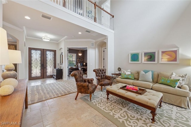 3441 Runaway Ln, Naples, FL 34114 - living room with arched walkways, french doors, crown molding, stone tile flooring, and a high ceiling