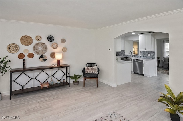 1721 Cascade Way N, Fort Myers, FL 33917 - living area featuring arched walkways, crown molding, and light wood-style floors