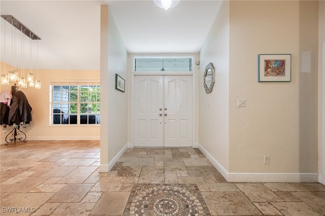 6011 Sea Grass Ln, Naples, FL 34116 - foyer entrance featuring stone tile floors