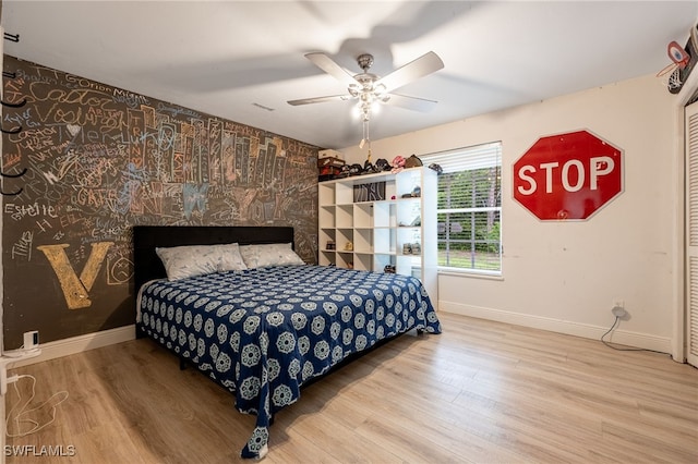 6011 Sea Grass Ln, Naples, FL 34116 - bedroom with wood finished floors and a ceiling fan