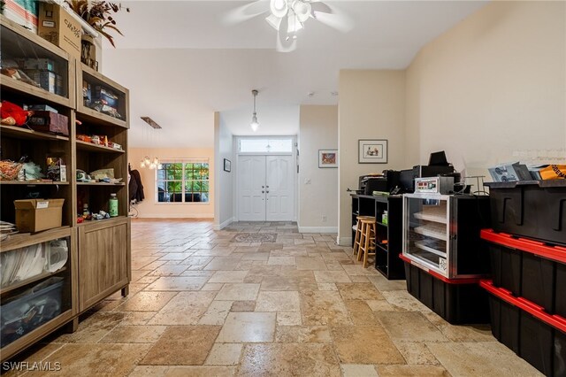 6011 Sea Grass Ln, Naples, FL 34116 - entrance foyer featuring stone tile floors and a ceiling fan