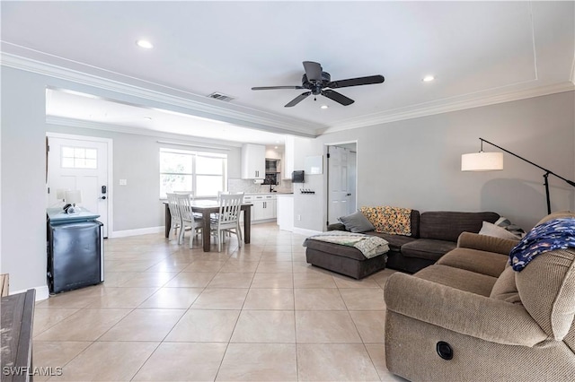 2401 Parkway St, Fort Myers, FL 33901 - living room featuring ceiling fan, ornamental molding, light tile patterned flooring, and recessed lighting
