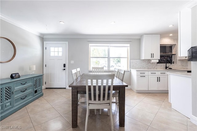2401 Parkway St, Fort Myers, FL 33901 - dining space with light tile patterned floors and crown molding