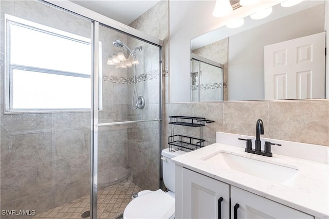 2401 Parkway St, Fort Myers, FL 33901 - bathroom featuring tile walls, vanity, and a stall shower