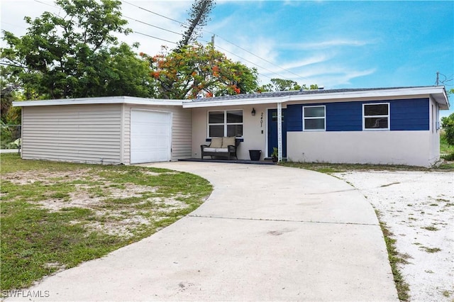 2401 Parkway St, Fort Myers, FL 33901 - single story home with an attached garage, driveway, and stucco siding