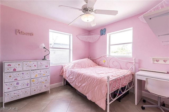 2401 Parkway St, Fort Myers, FL 33901 - bedroom with multiple windows, a ceiling fan, and tile patterned flooring