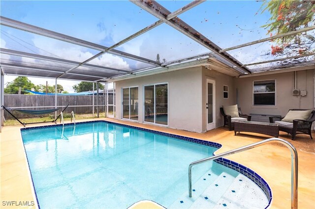 2401 Parkway St, Fort Myers, FL 33901 - view of pool featuring a patio area, an outdoor living space, and glass enclosure