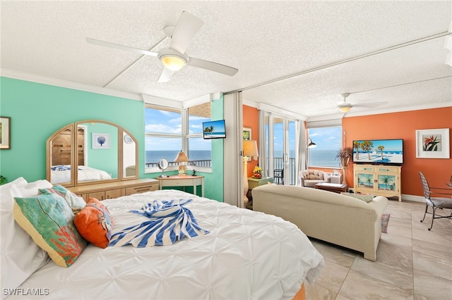 7360 Estero Blvd Unit Ph5, Fort Myers Beach, FL 33931 - bedroom with ornamental molding, a textured ceiling, a ceiling fan, and access to exterior