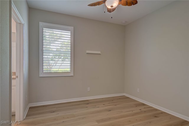 1964 Parson St, Naples, FL 34120 - spare room with light wood-style floors, ceiling fan, and healthy amount of natural light