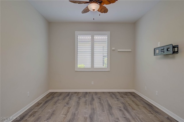 1964 Parson St, Naples, FL 34120 - empty room with ceiling fan and wood finished floors