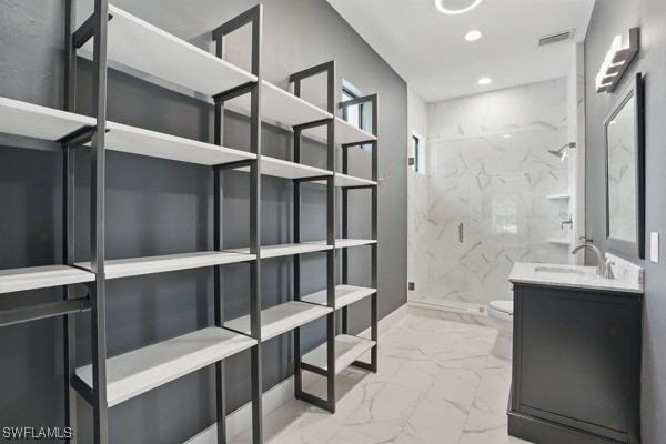 4740 5th Ave SW, Naples, FL 34119 - full bathroom with marble finish flooring, a marble finish shower, vanity, and recessed lighting