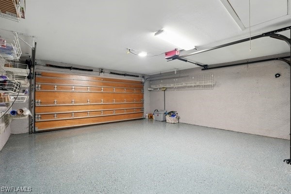 4740 5th Ave SW, Naples, FL 34119 - garage with a garage door opener