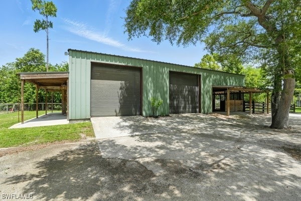 4740 5th Ave SW, Naples, FL 34119 - garage featuring a detached garage and driveway