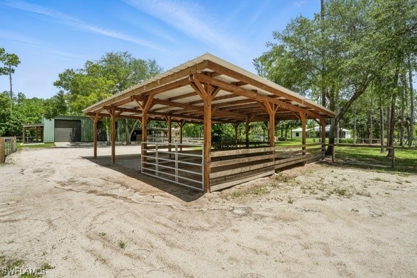 4740 5th Ave SW, Naples, FL 34119 - view of property's community featuring a riding arena, an outbuilding, and an exterior structure