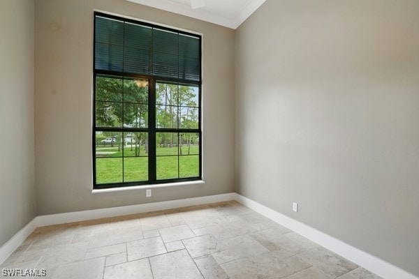 4740 5th Ave SW, Naples, FL 34119 - unfurnished room with stone tile floors and ornamental molding