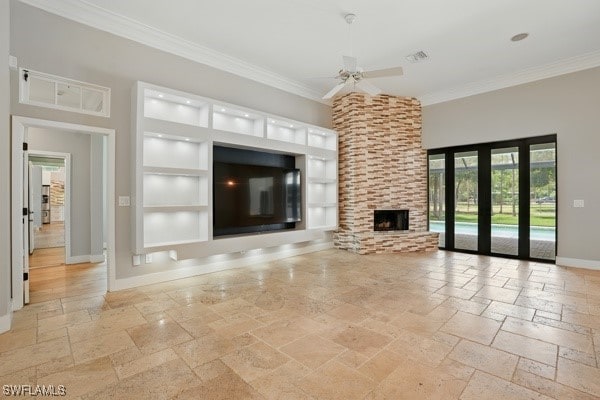 4740 5th Ave SW, Naples, FL 34119 - unfurnished living room with stone tile floors, ornamental molding, built in features, a ceiling fan, and a large fireplace