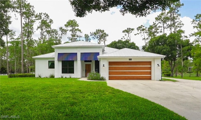 4740 5th Ave SW, Naples, FL 34119 - view of front of house with driveway, a garage, a front lawn, and stucco siding
