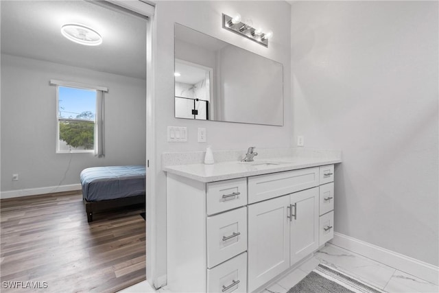 311 Long Ave S, Lehigh Acres, FL 33974 - bathroom with vanity and baseboards