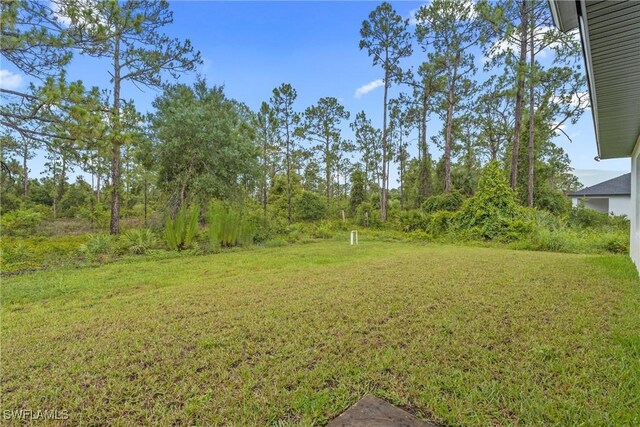 311 Long Ave S, Lehigh Acres, FL 33974 - view of grassy yard