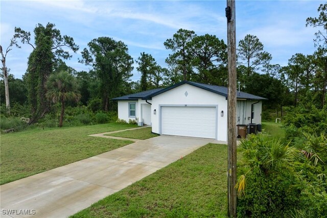 311 Long Ave S, Lehigh Acres, FL 33974 - single story home with an attached garage, driveway, a front lawn, and stucco siding